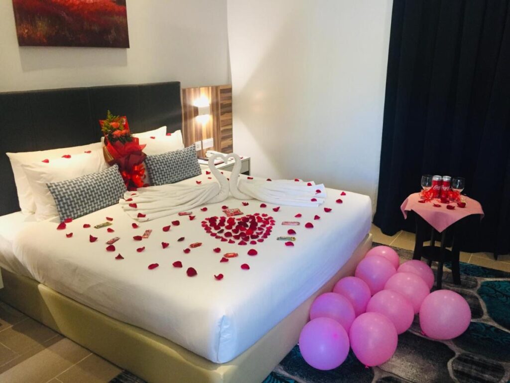 ROMANTIC bed with rose petals on